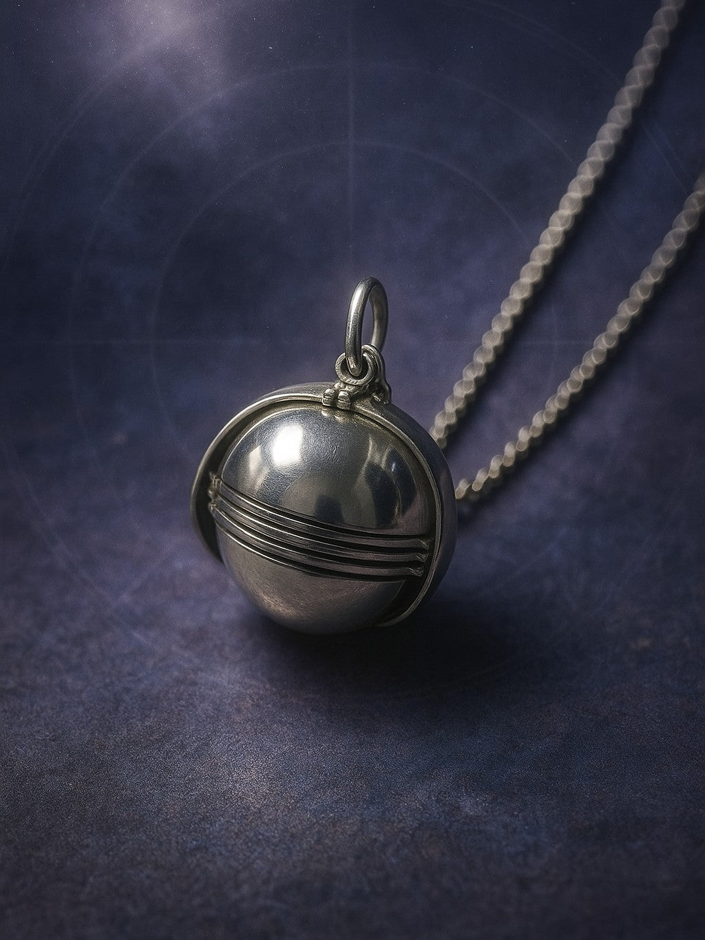 Sterling silver orb locket unfolded into six petal-like frames on a chain, high-polish finish.