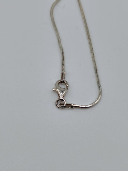 Sterling silver snake chain with clasp.