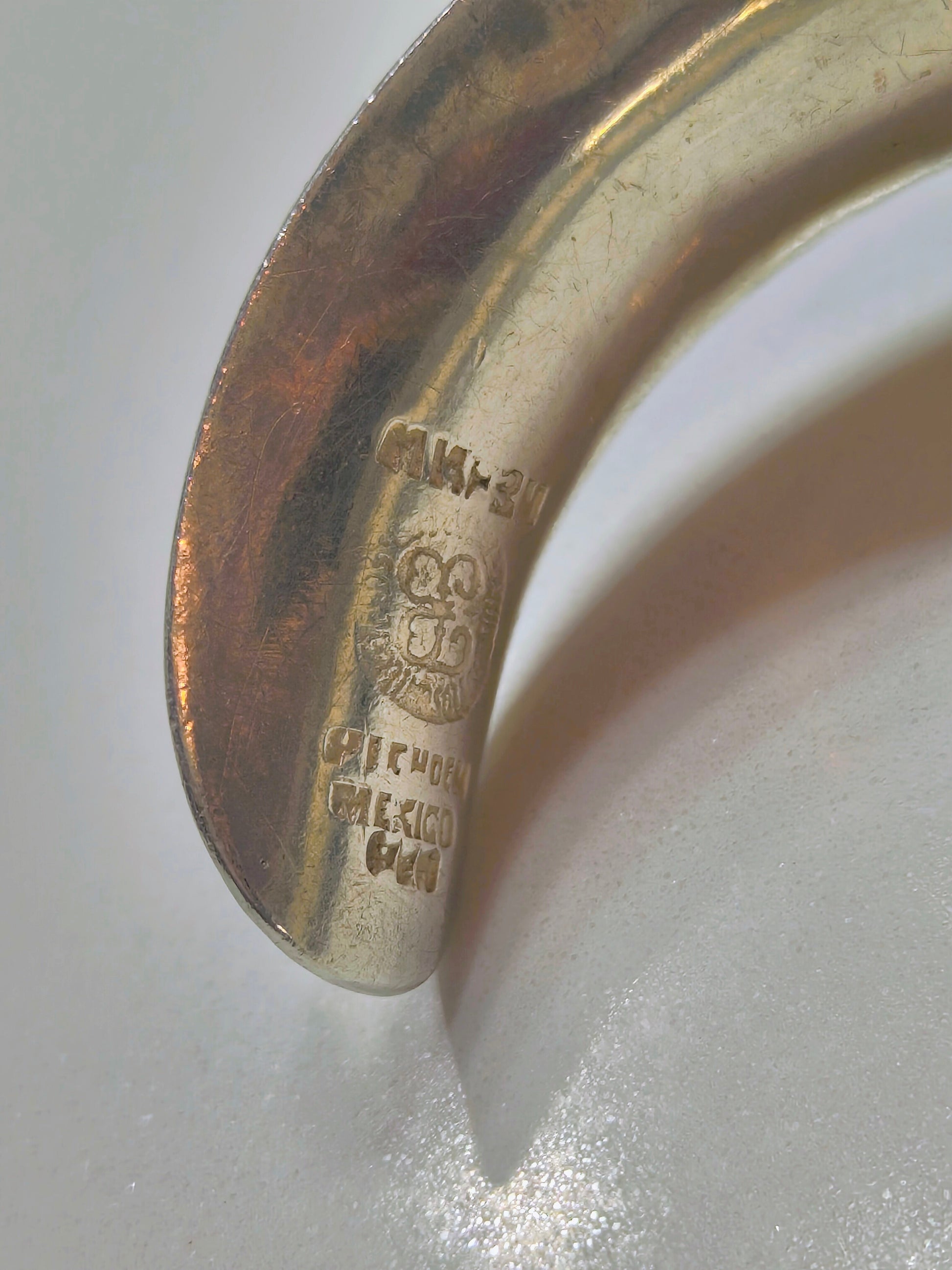 Close-up of the inside of the sterling silver cuff showing Mexico 925 hallmark and maker’s mark.