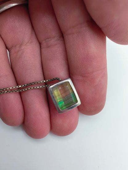 Sterling silver necklace featuring a rectangular bezel-set fluorite stone that fades from honey yellow to mossy green, hanging from an 18-inch box chain