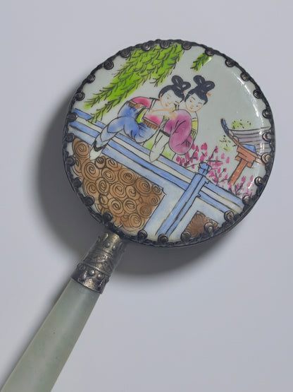 Vintage Chinese jadeite hand mirror shows a painted porcelain scene of two figures under willow branches, in sterling silver.