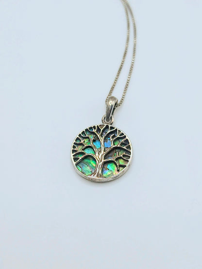 Sterling silver Tree of Life pendant with iridescent green and blue abalone shell inlay, with a delicate silver box chain.