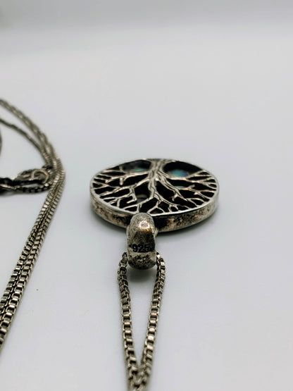 Sterling silver Tree of Life pendant with iridescent green and blue abalone shell inlay, with a delicate silver box chain.