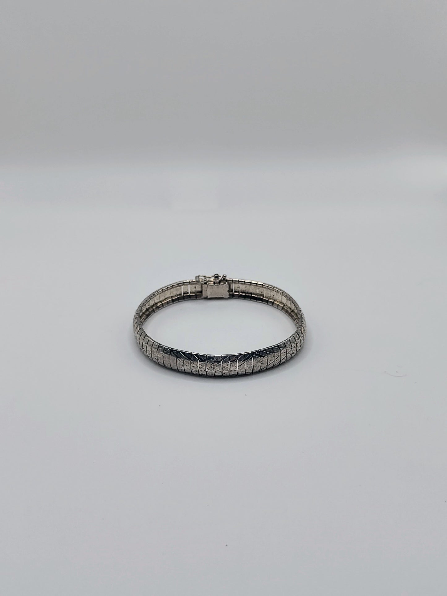 Front view of the Silver Omega Bracelet showing the full oval shape and scale-like texture.