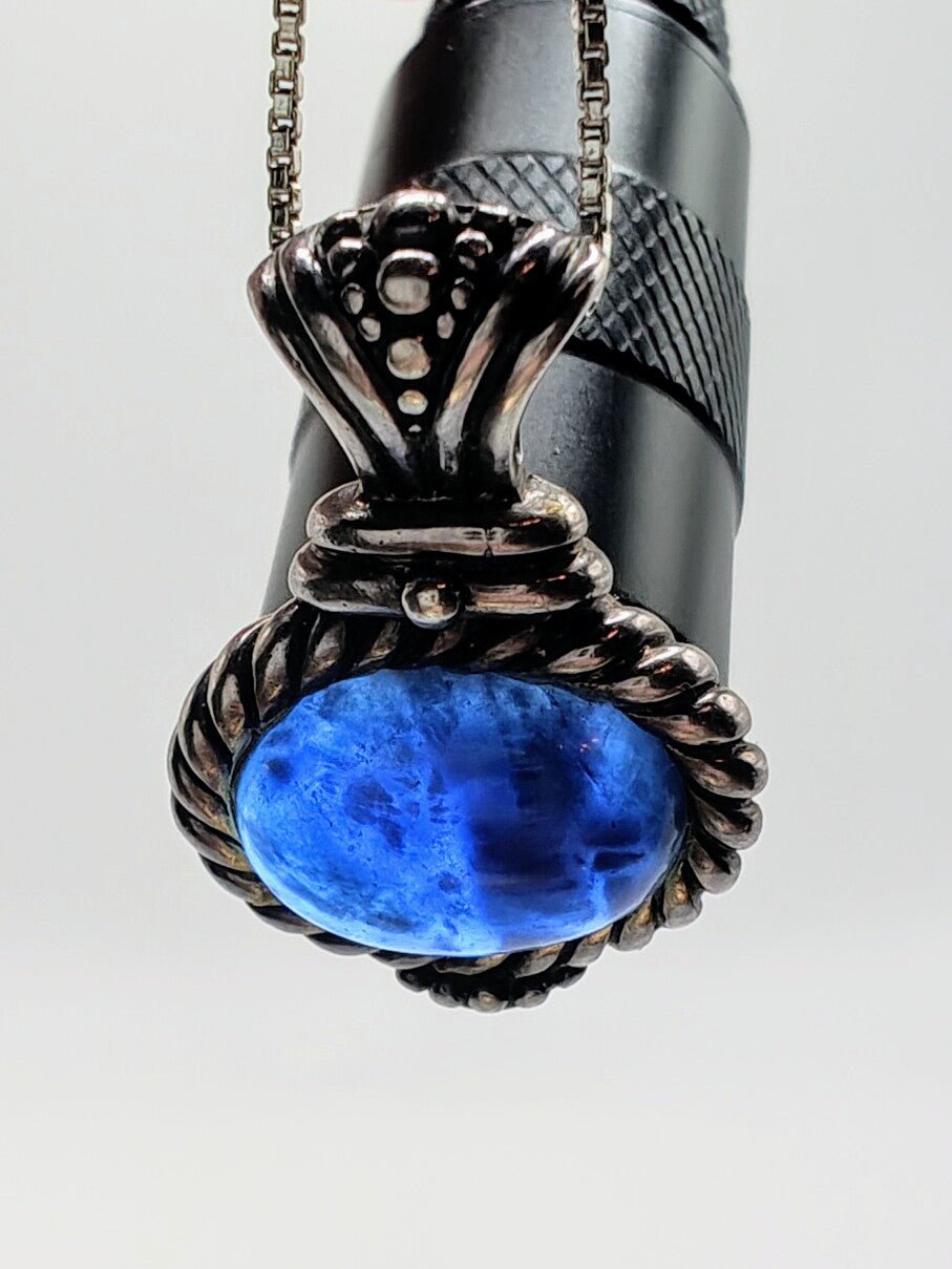 Close-up of the Sodalite Wisdom Necklace pendant with an oval deep blue sodalite stone set in twisted sterling silver rope.